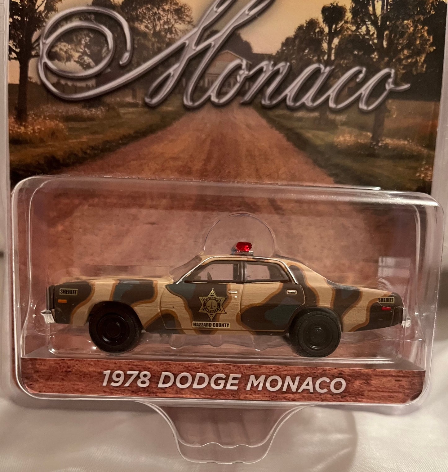 1:64 CAMOUFLAGE 1978 DODGE MONACO HAZZARD COUNTY SHERIFF Discontinued by manufacturer — final inventory!